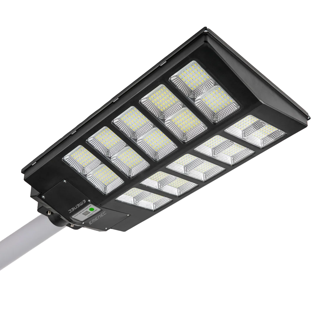 A rectangular LED streetlight with multiple LED panels mounted on a pole, emitting bright light.