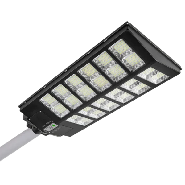 Close-up view of a rectangular LED street light attached to a pole, featuring multiple LED panels and a visible control module.