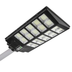 A rectangular LED street light with multiple illuminated panels is mounted on a pole against a white background.